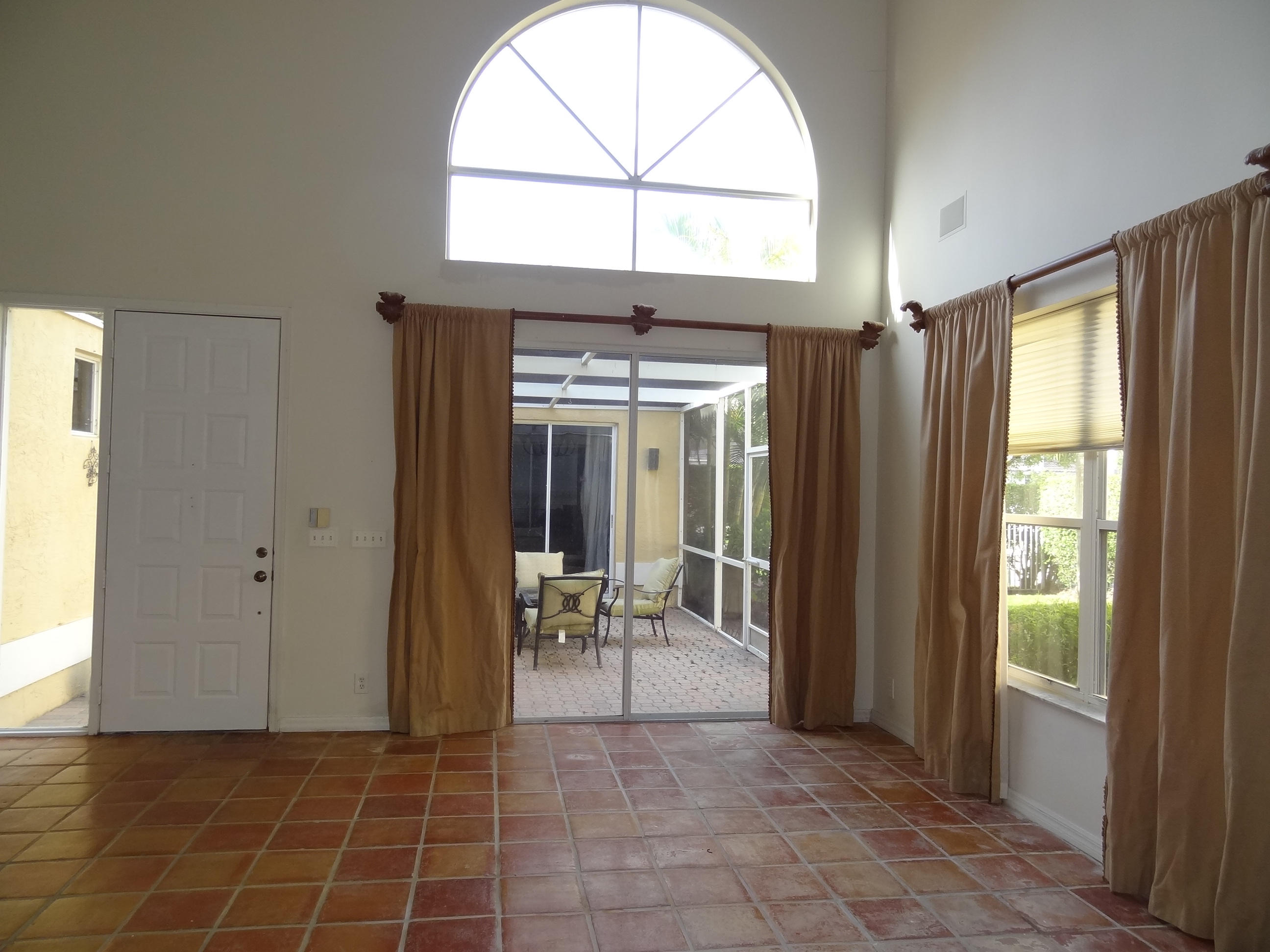 11050 Harbour Springs Circle Boca Raton, FL 33428 - Photo 8 of 20 LIVING ROOM LOOKING OUT TO COURTYARD