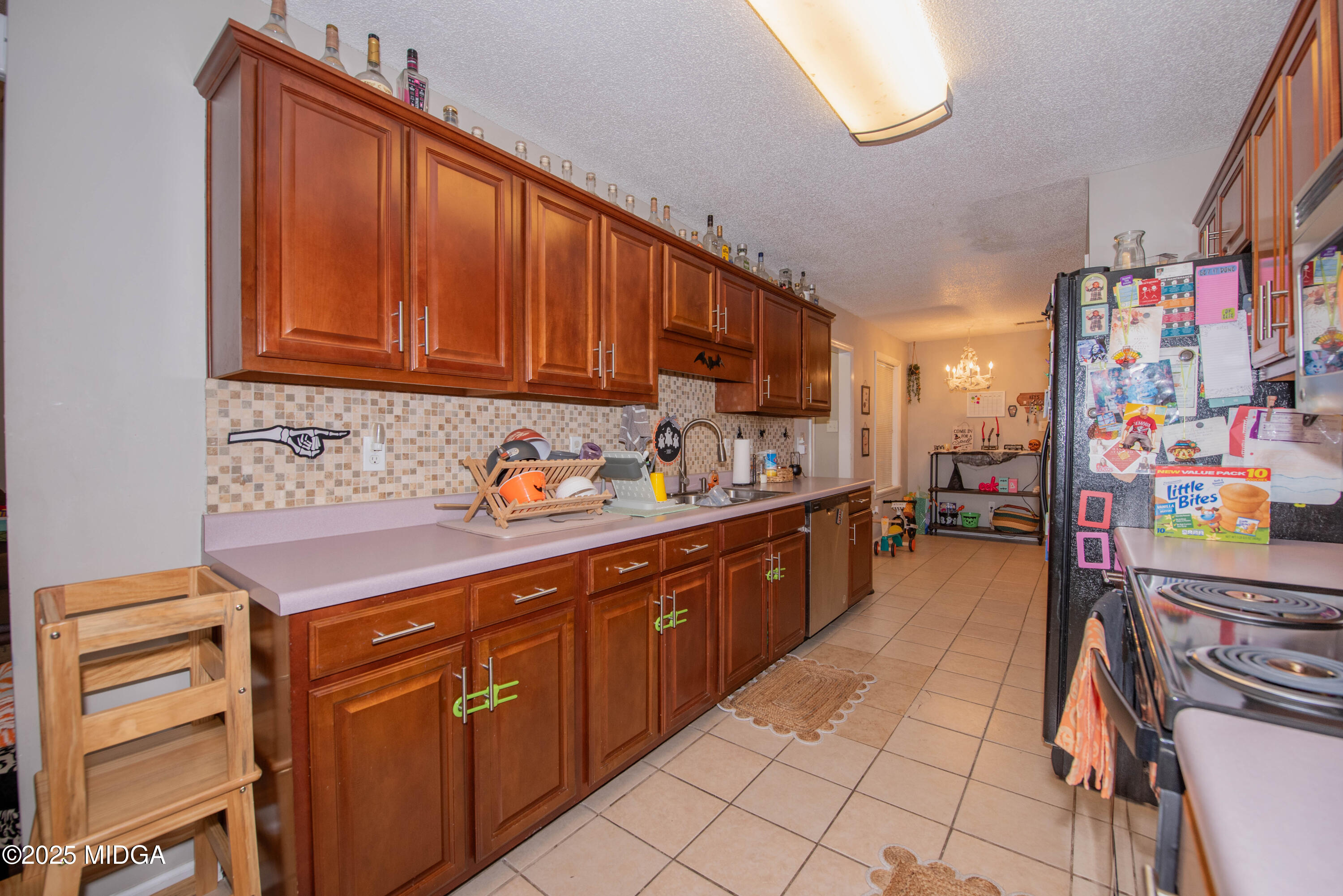 111 Oak Ridge Drive Warner Robins, GA 31093 - Photo 11 of 25 a kitchen with stainless steel appliances granite countertop a sink and cabinets