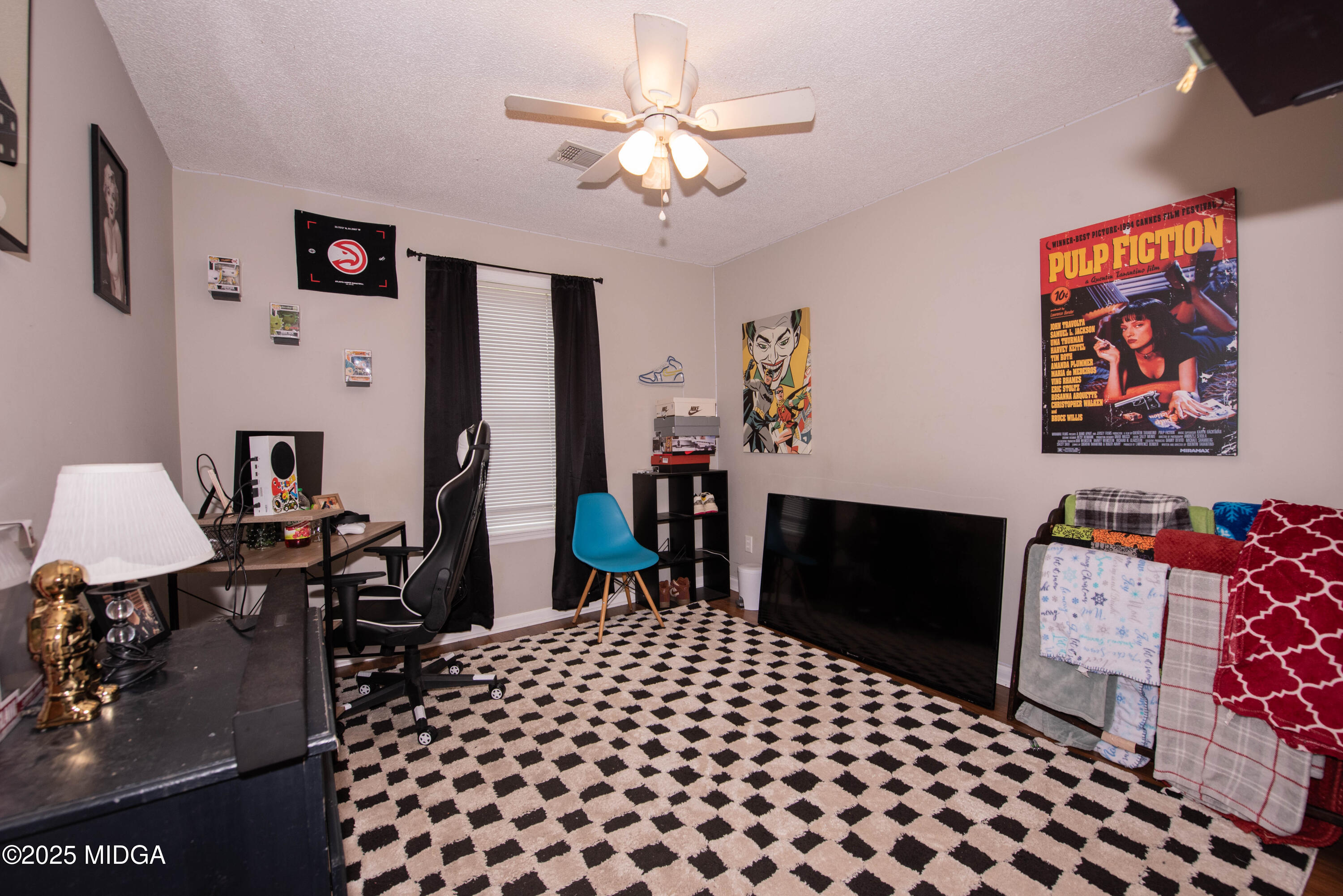 111 Oak Ridge Drive Warner Robins, GA 31093 - Photo 16 of 25 a bedroom with furniture and a chandelier
