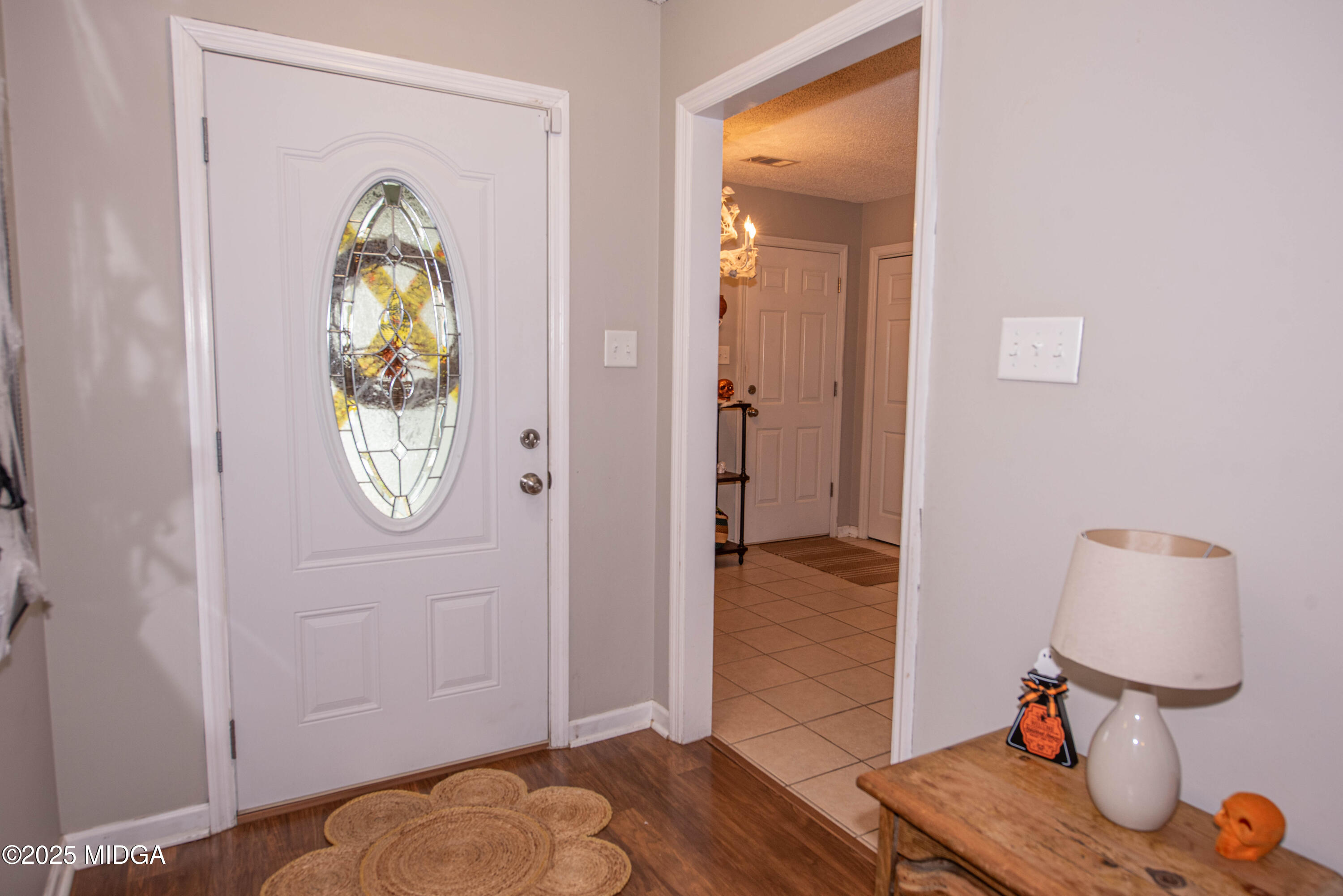 111 Oak Ridge Drive Warner Robins, GA 31093 - Photo 3 of 25 view of bedroom with wooden floor and mirror