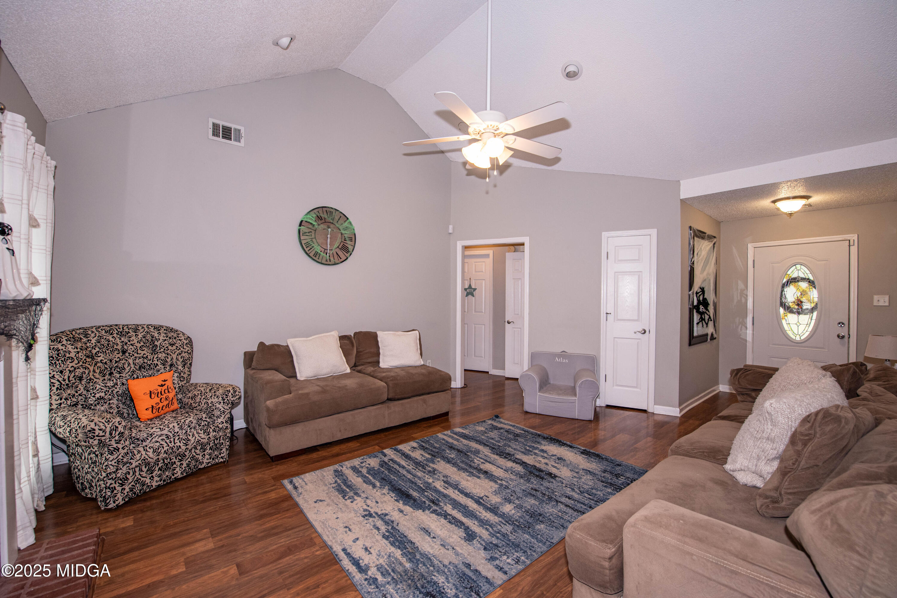 111 Oak Ridge Drive Warner Robins, GA 31093 - Photo 5 of 25 a living room with furniture and a rug