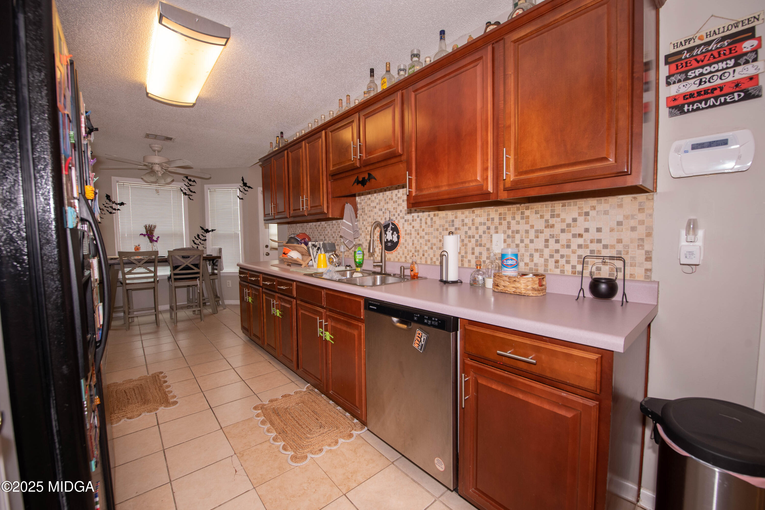 111 Oak Ridge Drive Warner Robins, GA 31093 - Photo 8 of 25 a kitchen with stainless steel appliances granite countertop a sink stove and cabinets