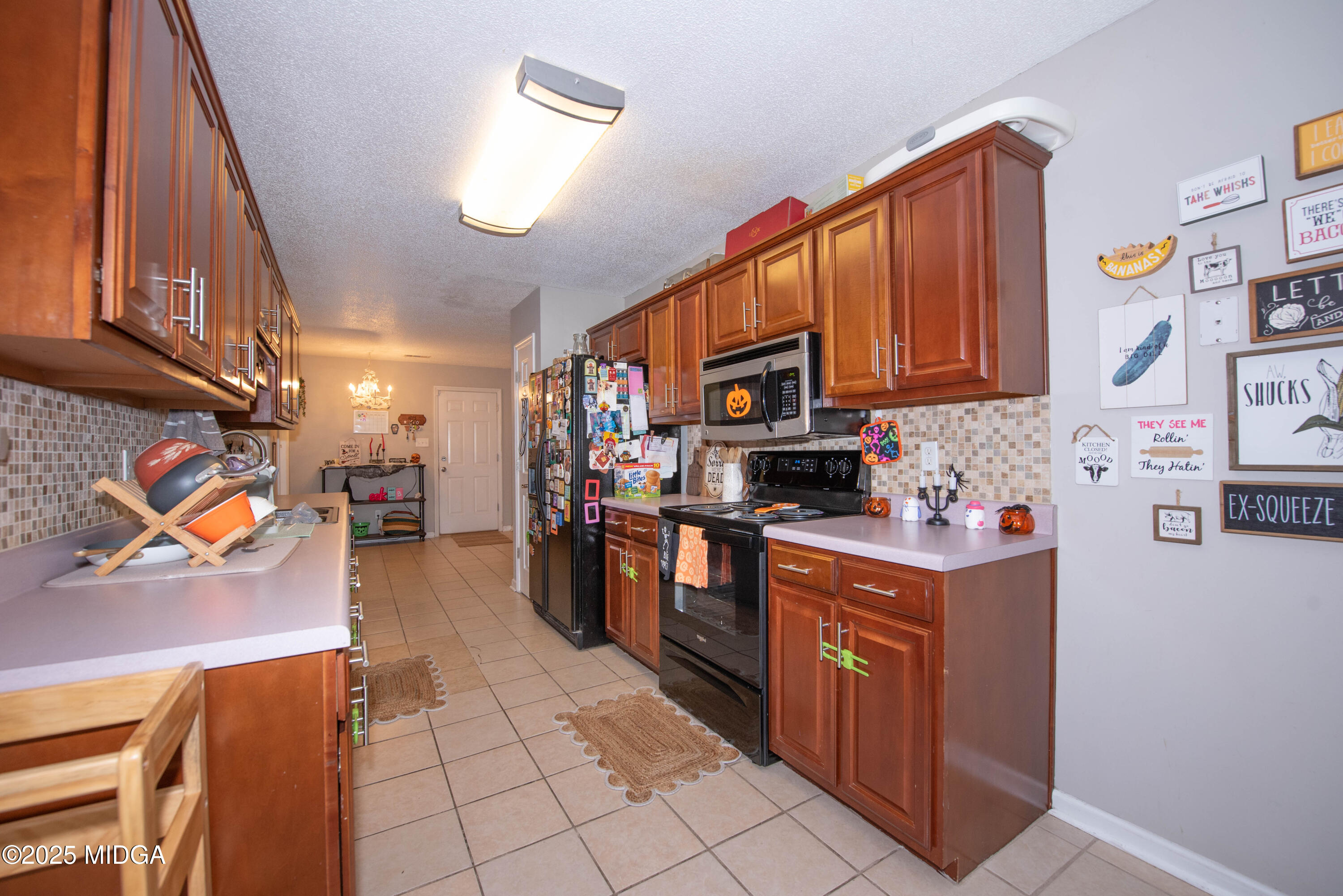111 Oak Ridge Drive Warner Robins, GA 31093 - Photo 10 of 25 a kitchen with stainless steel appliances granite countertop a refrigerator a stove top oven a sink and dishwasher