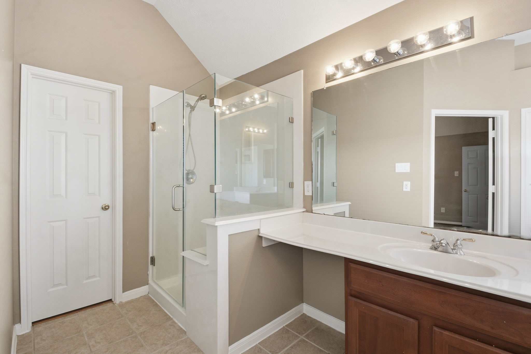 18915 Rustling Ridge Drive Tomball, TX 77377 - Photo 19 of 27 a bathroom with a double vanity sink and mirror