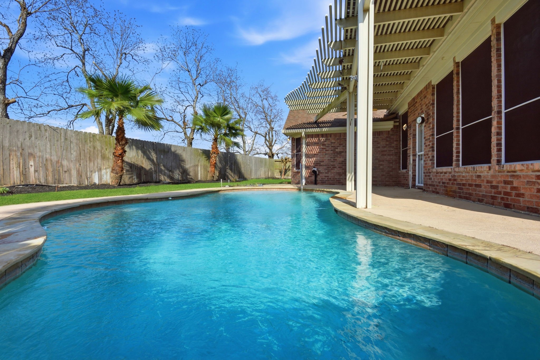 18915 Rustling Ridge Drive Tomball, TX 77377 - Photo 24 of 27 a view of a house with a garden