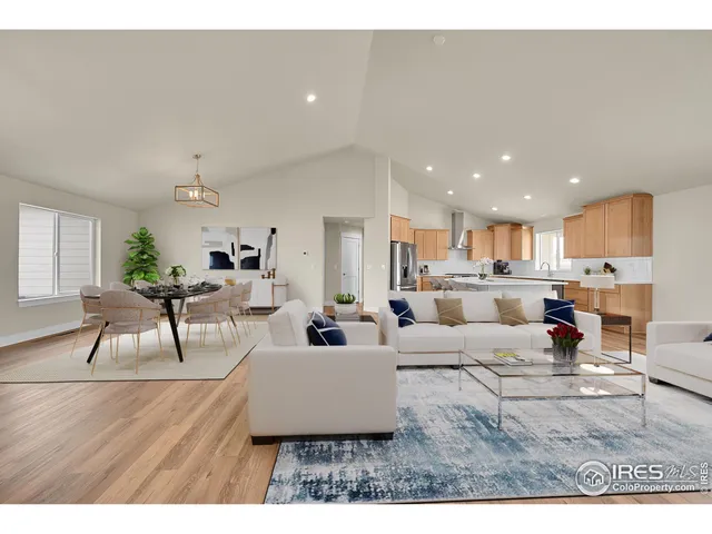 a kitchen with a refrigerator and a sink