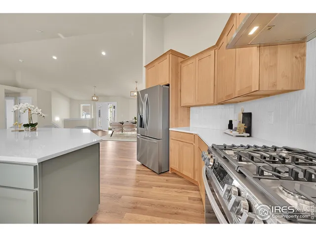 a kitchen with a stove a sink and a microwave