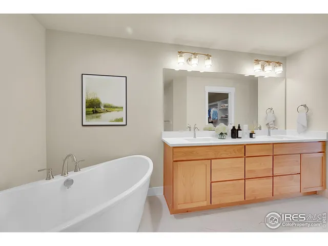 a bathroom with a bathtub shower sink and toilet