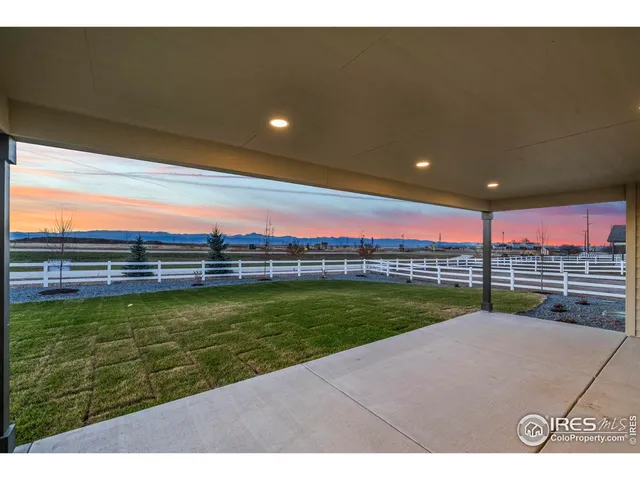 a view of a swimming pool and an outdoor seating