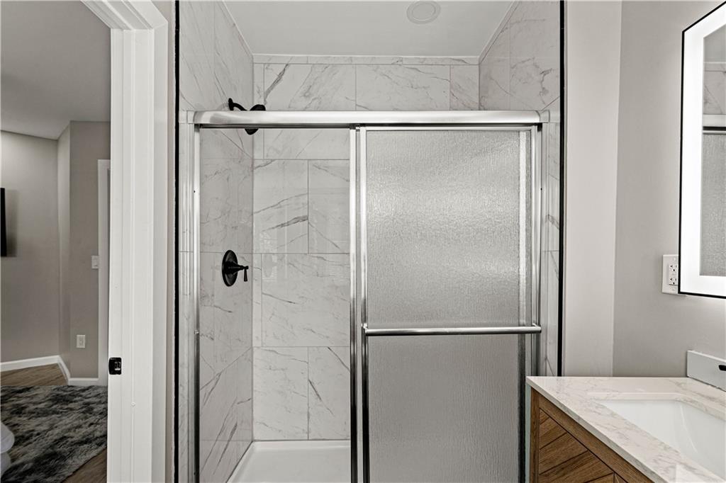 214 North Aiken Avenue Pittsburgh, PA 15206 - Photo 18 of 37 Tiled walk-in shower with glass door
