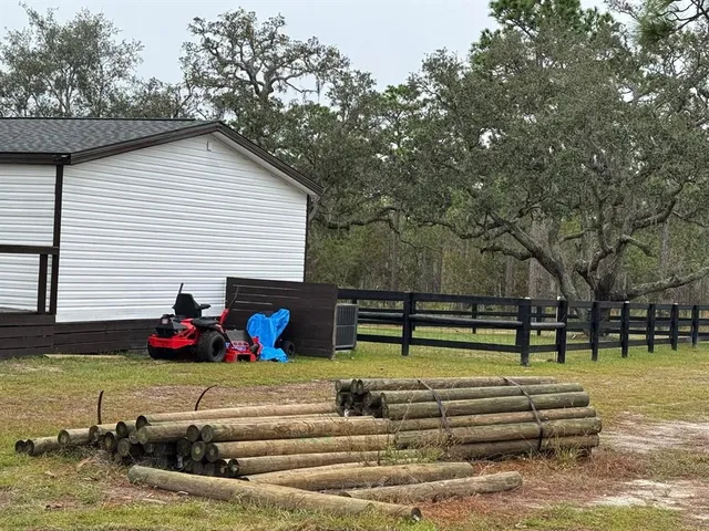 a living room with stainless steel appliances kitchen island granite countertop furniture and a kitchen view