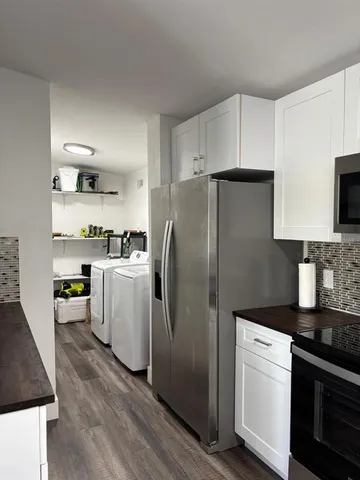 a kitchen with a stove and a microwave