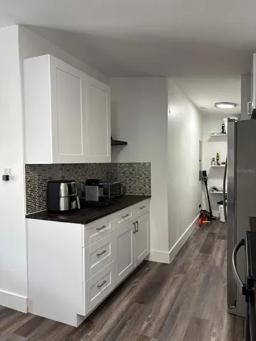 a view of a workspace with furniture