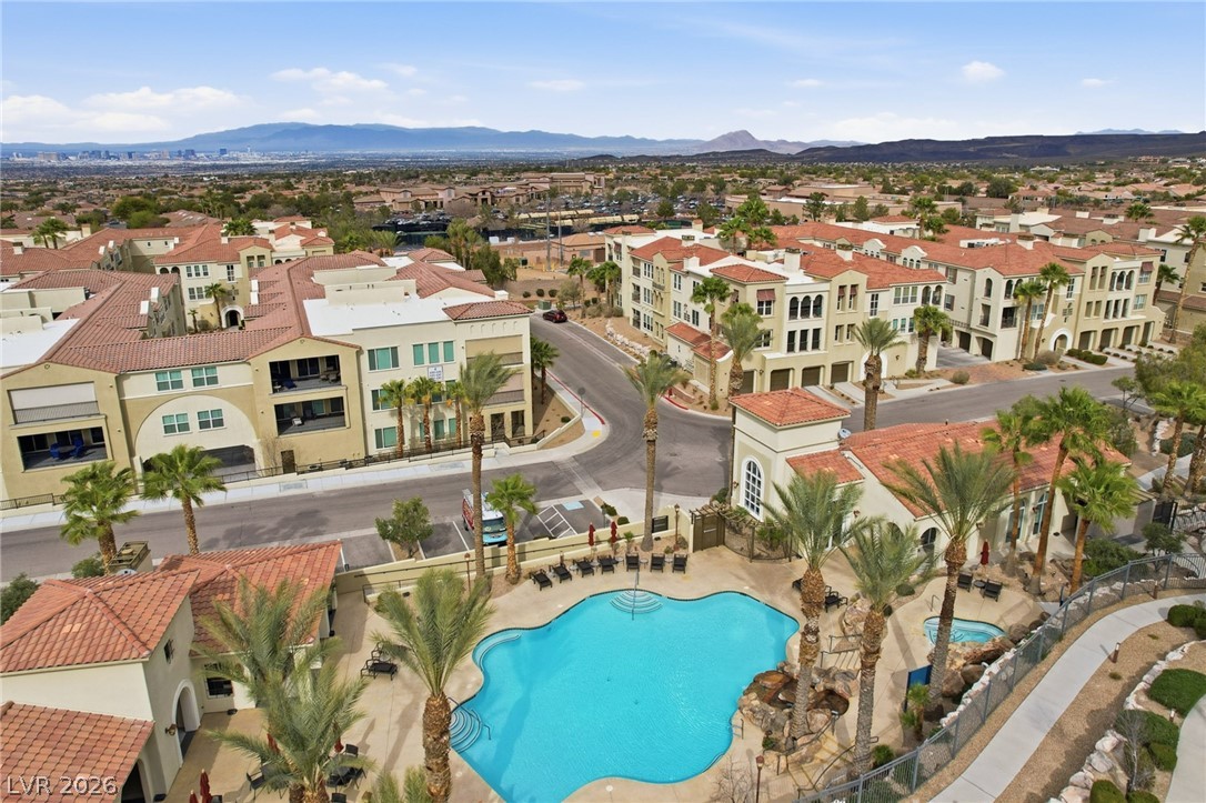 2555 Hampton Road, Unit 2208 Henderson, NV 89052 - Photo 1 of 45 Terra Bella - a gated 55+, 236 Condominium community. Mediterranean inspired architecture, buildings are 3 story with elevator access. Showing the community resort pool and spa.