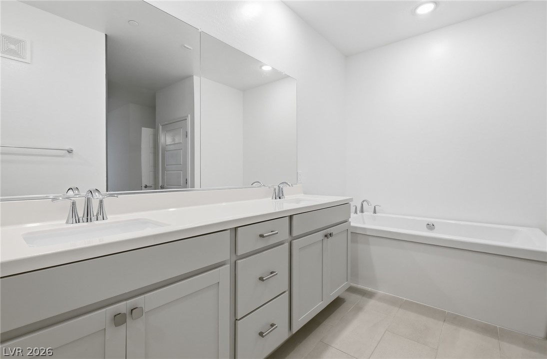 2555 Hampton Road, Unit 2208 Henderson, NV 89052 - Photo 19 of 45 Primary Bedroom - full bath with dual sinks, soaking tub and separate shower.