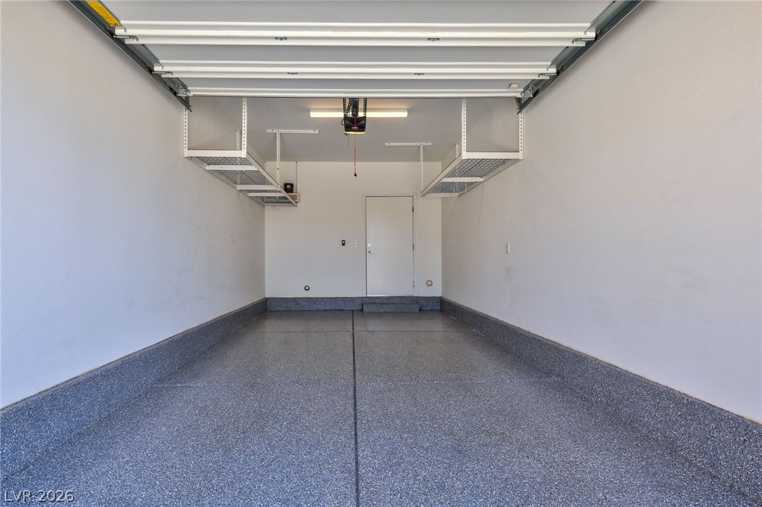 2555 Hampton Road, Unit 2208 Henderson, NV 89052 - Photo 29 of 45 Garage features epoxy flooring and convenient overhead storage shelves. Door leads to first floor elevator lobby.