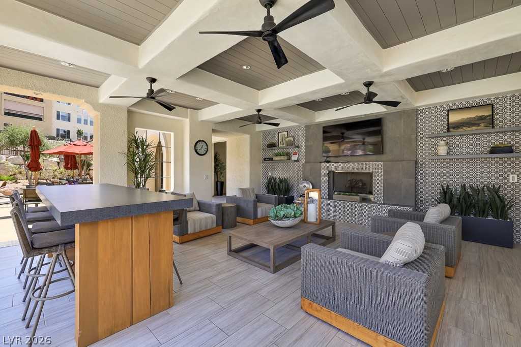 2555 Hampton Road, Unit 2208 Henderson, NV 89052 - Photo 43 of 45 Community - Outside Cabana featuring a TV and cozy fireplace, creating an ideal setting for relaxation.