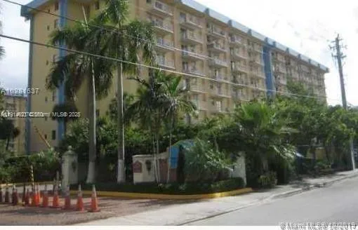a view of a building with a street
