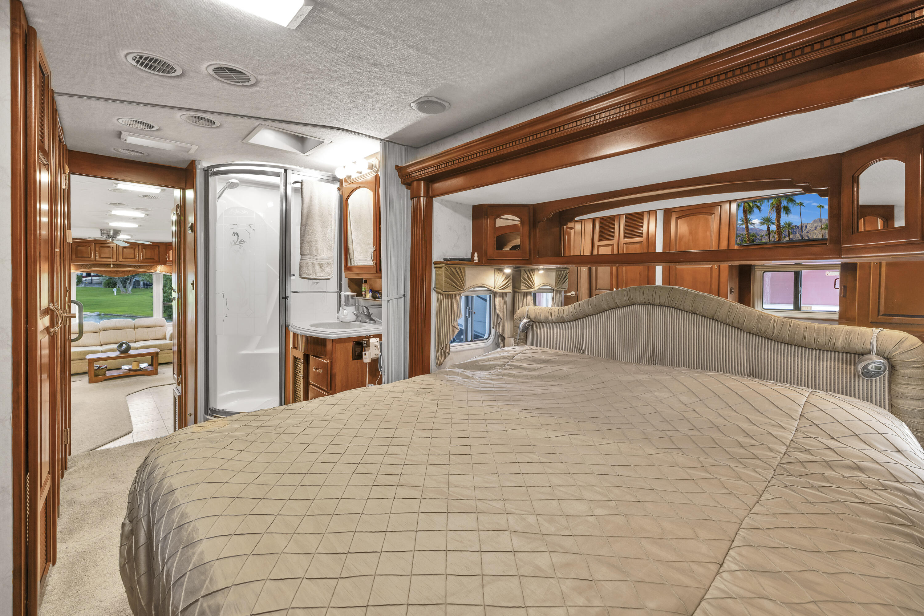 69411 Ramon Road, Unit 1203 Cathedral City, CA 92234 - Photo 17 of 74 a large bedroom with a large bed and a large window