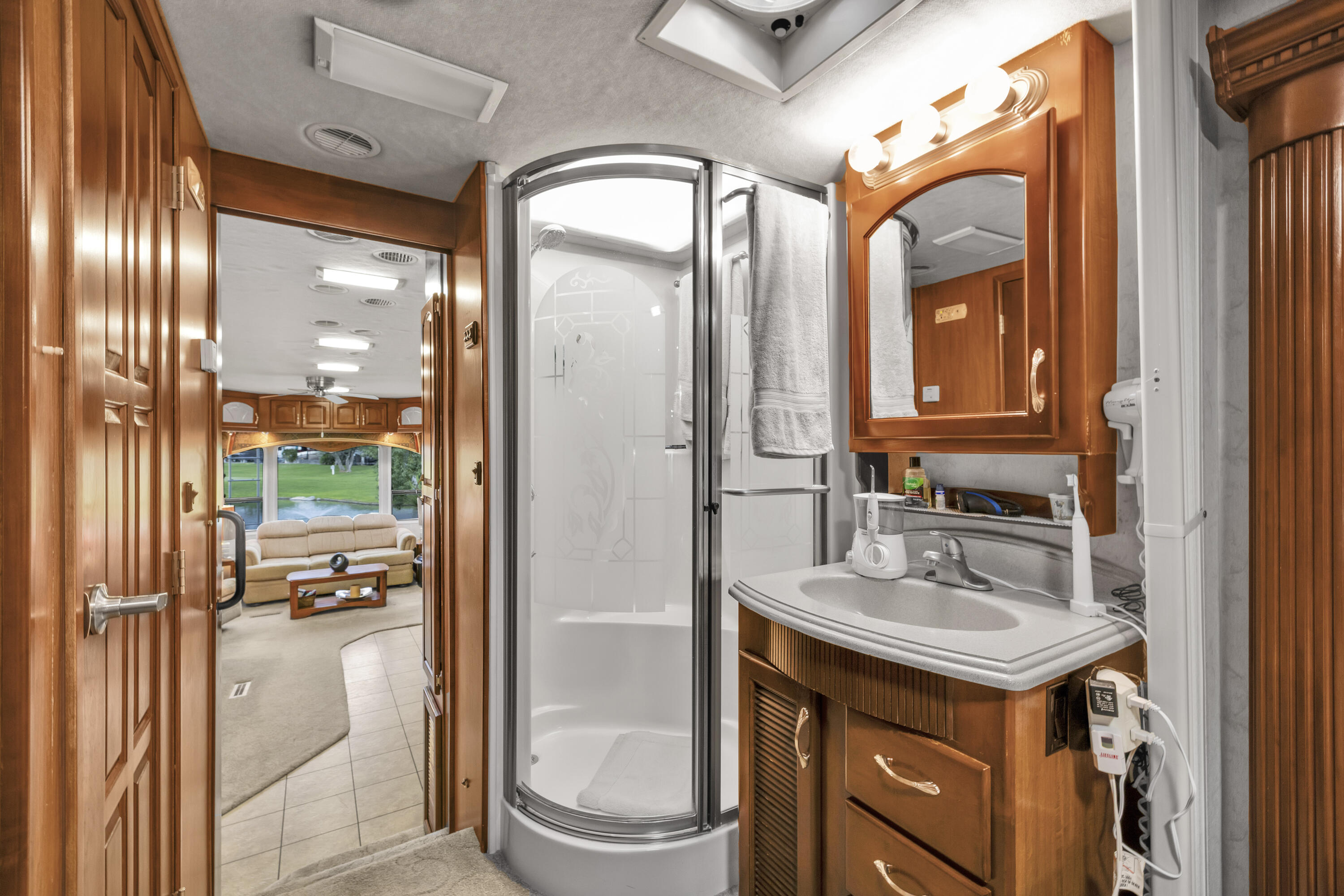 69411 Ramon Road, Unit 1203 Cathedral City, CA 92234 - Photo 30 of 74 a bathroom with a sink a toilet and shower