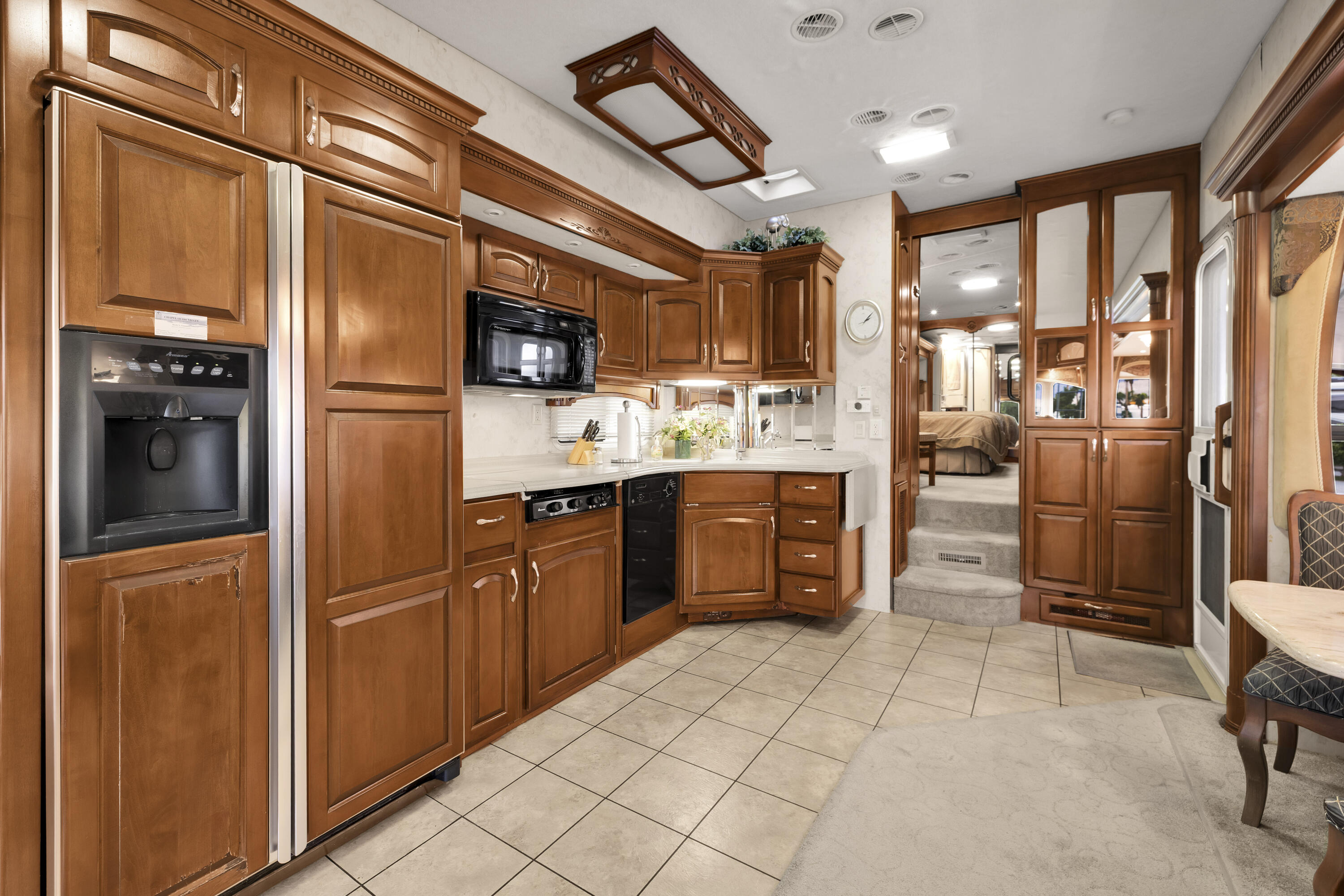 69411 Ramon Road, Unit 1203 Cathedral City, CA 92234 - Photo 32 of 74 a kitchen with stainless steel appliances granite countertop a refrigerator and a stove top oven
