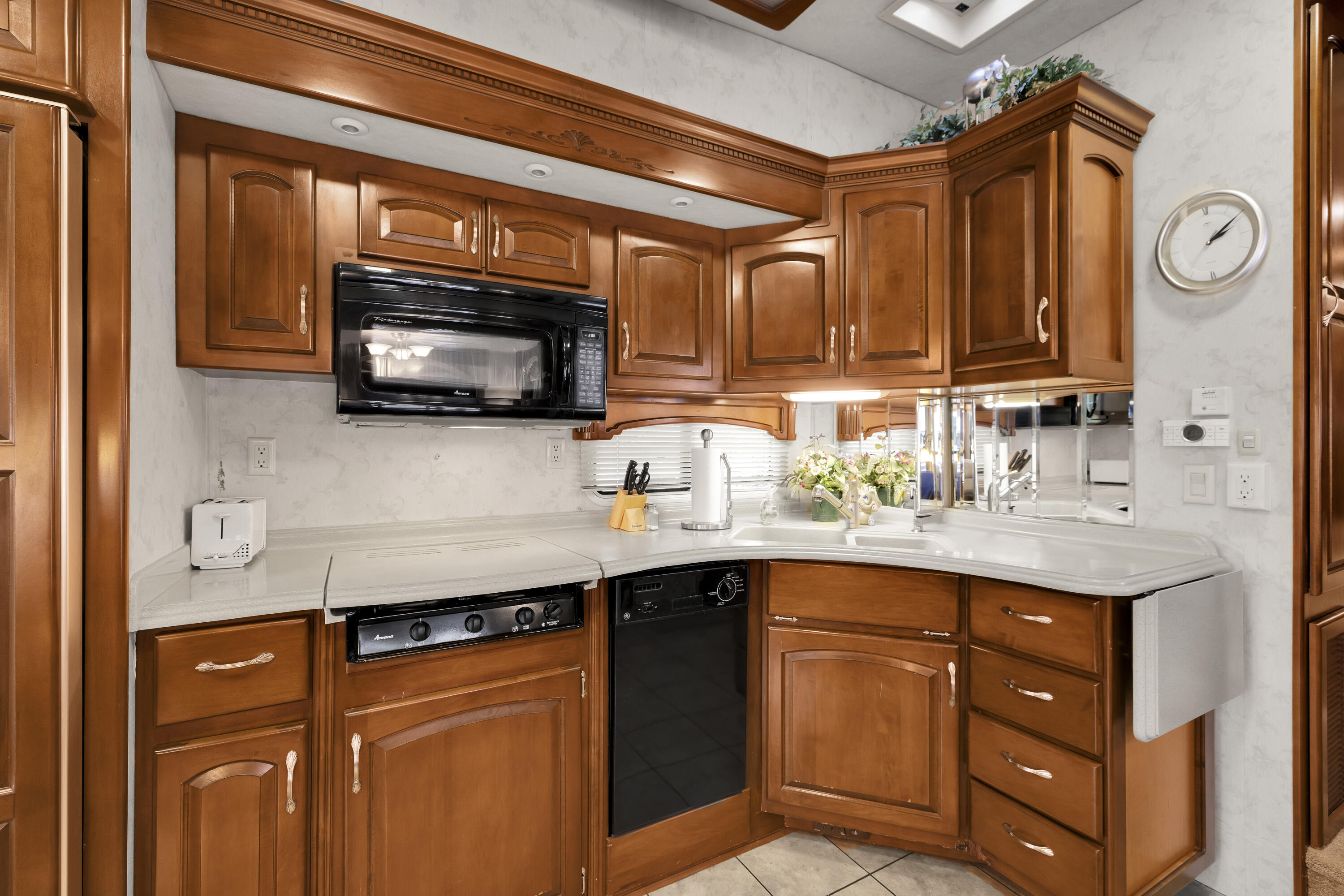 69411 Ramon Road, Unit 1203 Cathedral City, CA 92234 - Photo 33 of 74 a kitchen with stainless steel appliances granite countertop a sink and a microwave