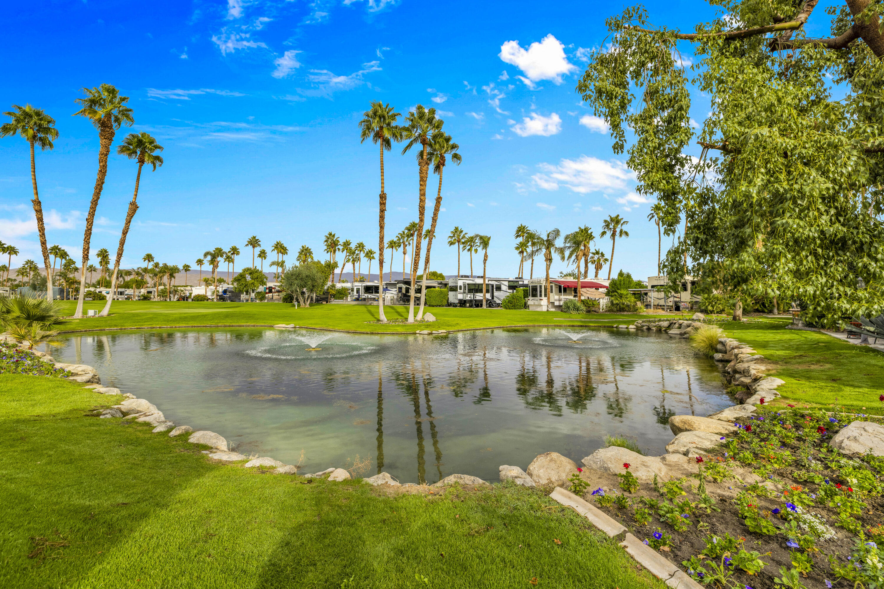 69411 Ramon Road, Unit 1203 Cathedral City, CA 92234 - Photo 6 of 74 a view of a lake with houses