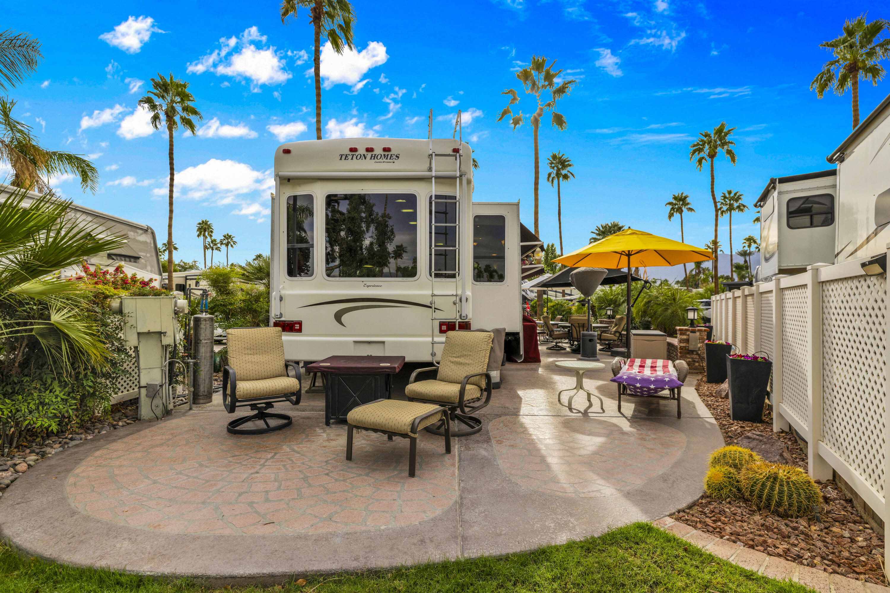 69411 Ramon Road, Unit 1203 Cathedral City, CA 92234 - Photo 7 of 74 a building outdoor space with patio furniture and potted plants
