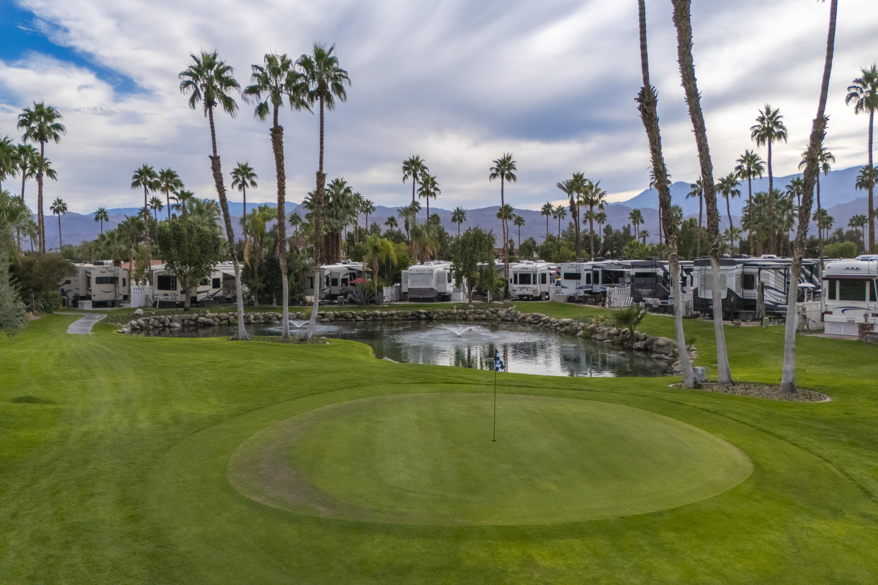 69411 Ramon Road, Unit 1203 Cathedral City, CA 92234 - Photo 10 of 74 a view of a swimming pool with a garden