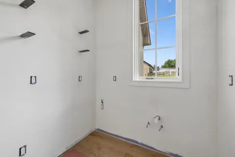 a spacious bedroom with a large bed and a large window