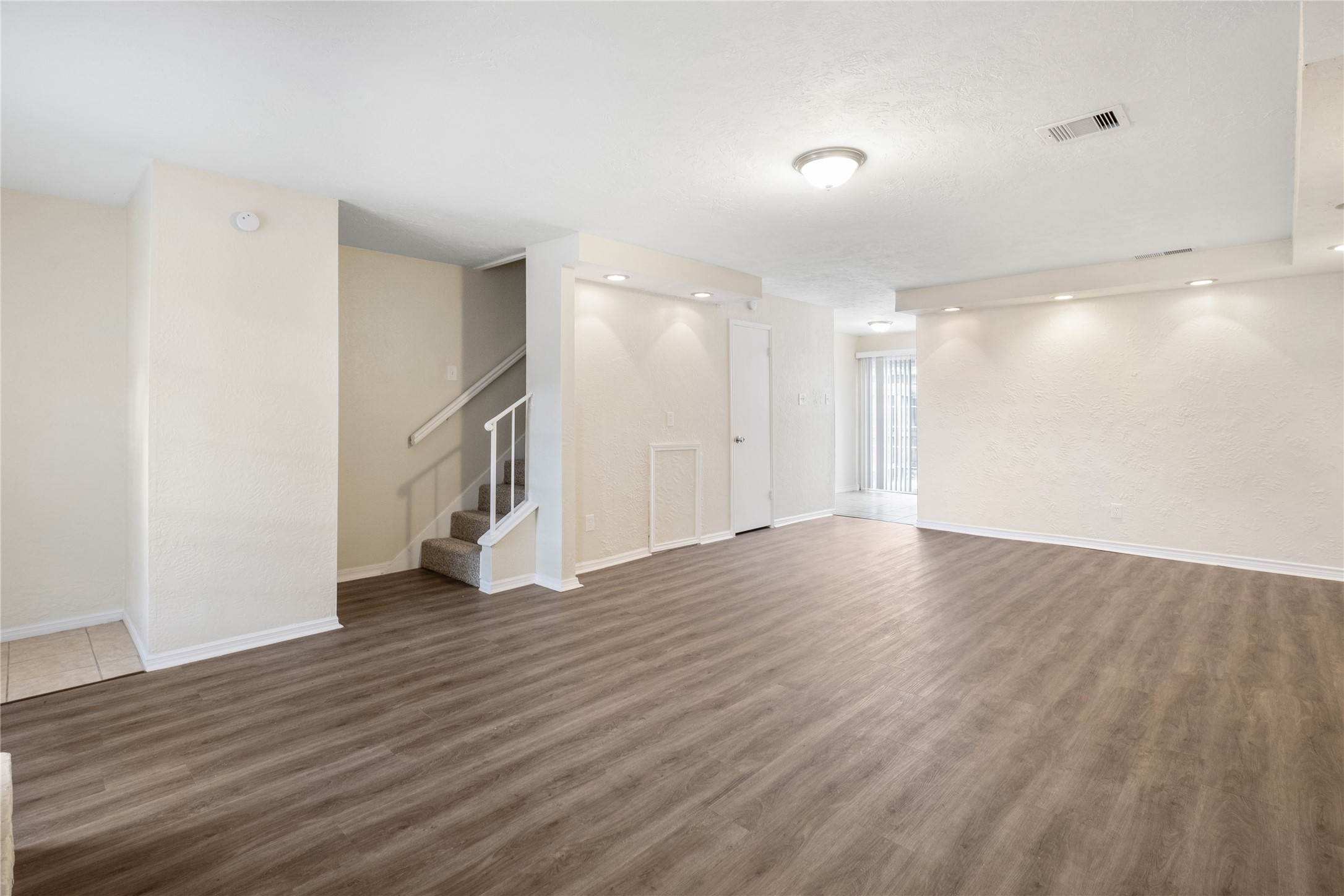 14759 Perthshire Road Houston, TX 77079 - Photo 2 of 9 a view of a room with wooden floor