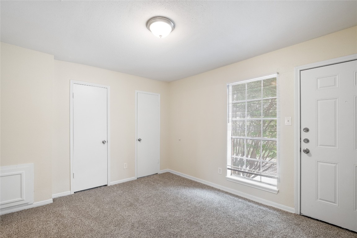 14759 Perthshire Road Houston, TX 77079 - Photo 8 of 9 an empty room with windows