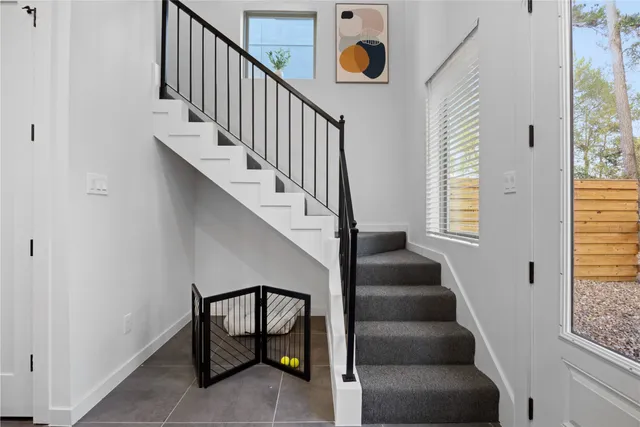 a view of entryway and hall with wooden floor