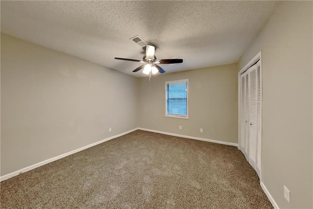 2788 Water Valley Road Austell, GA 30106 - Photo 13 of 20 a view of a livingroom with a ceiling fan and window