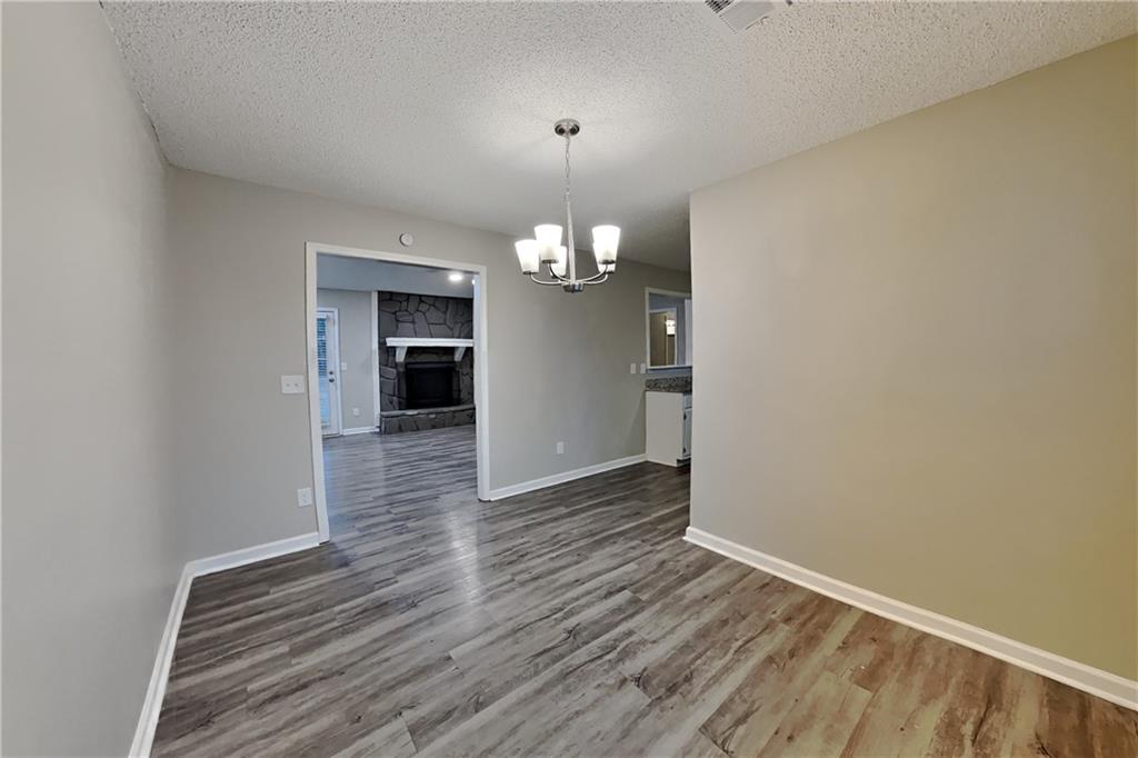 2788 Water Valley Road Austell, GA 30106 - Photo 5 of 20 wooden floor in an empty room with a window