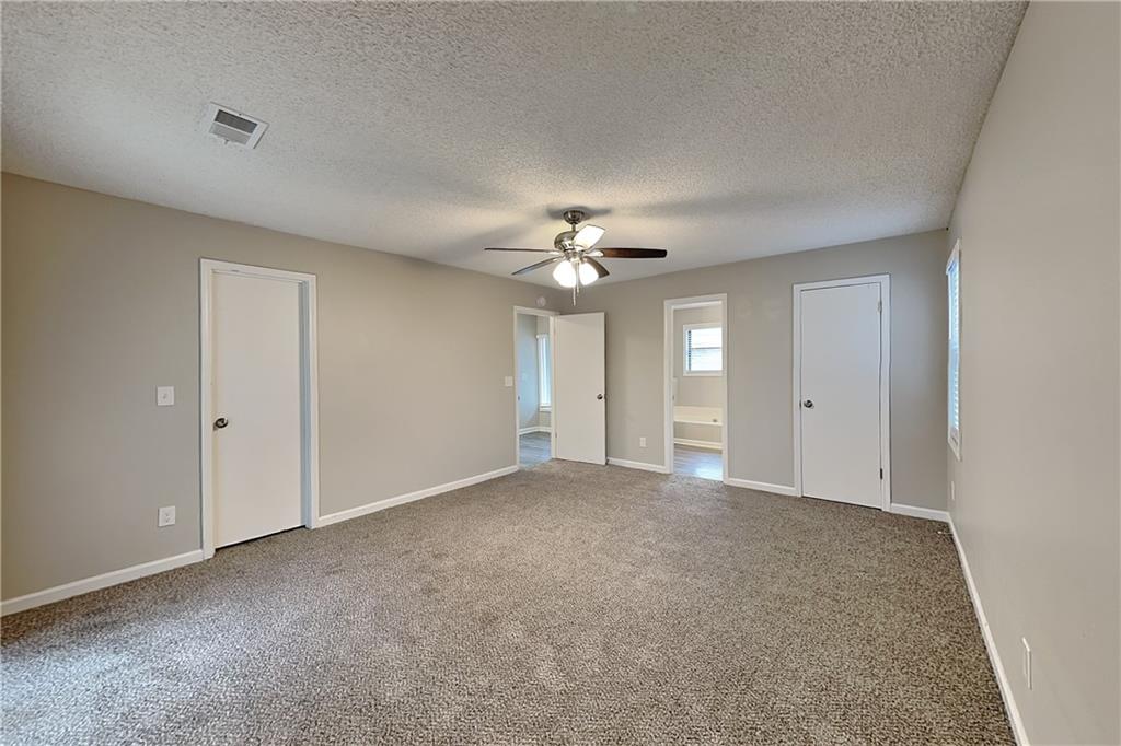 2788 Water Valley Road Austell, GA 30106 - Photo 8 of 20 a view of an empty room with a ceiling fan