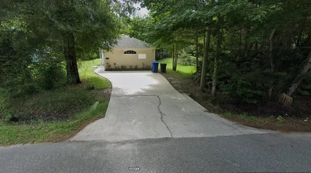 a view of a back yard of the house