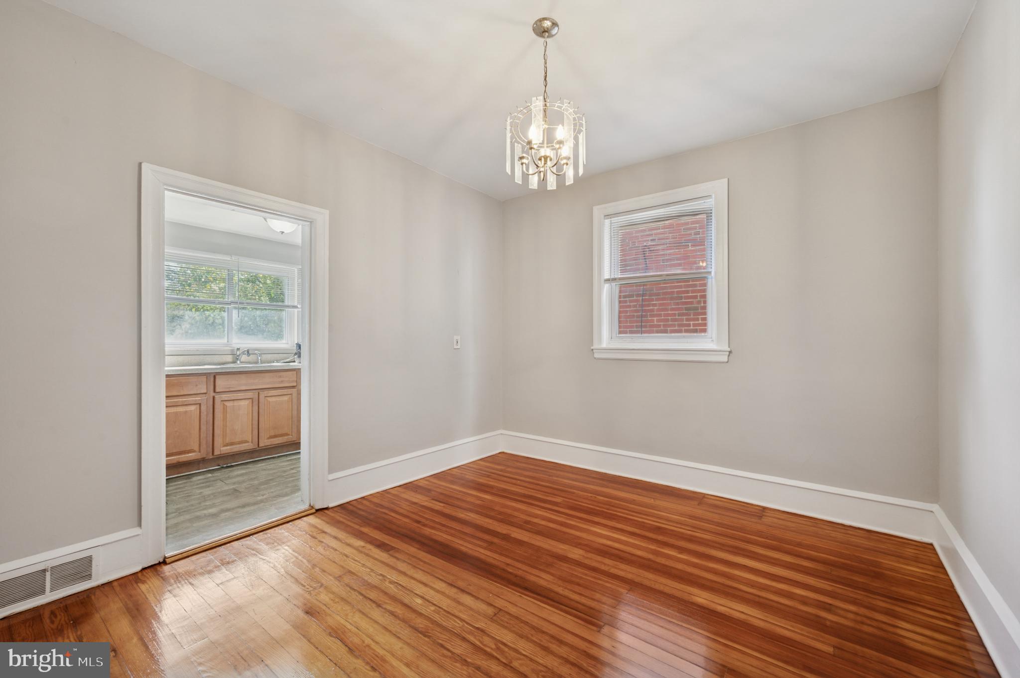 7920 West Chester Pike Upper Darby, PA 19082 - Photo 5 of 13 Bright and airy room with polished floors.