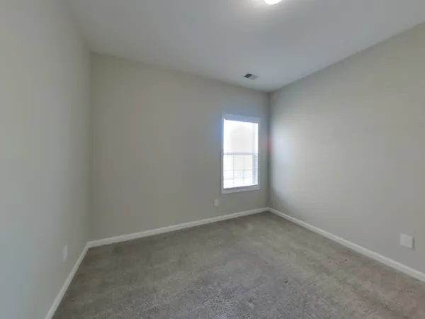 a bathroom with a sink vanity and toilet