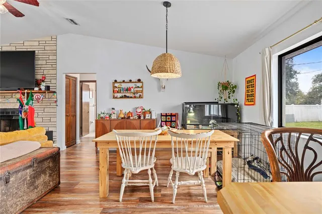 a very nice looking room with a dining table and chairs