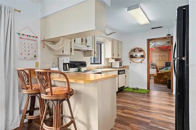 a living room with furniture fireplace and flat screen tv