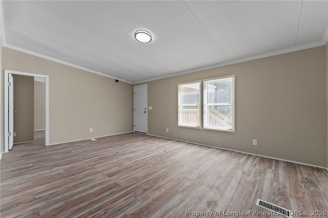 515 Mt Zion Road Red Springs, NC 28377 - Photo 20 of 50 a view of an empty room with wooden floor and a window