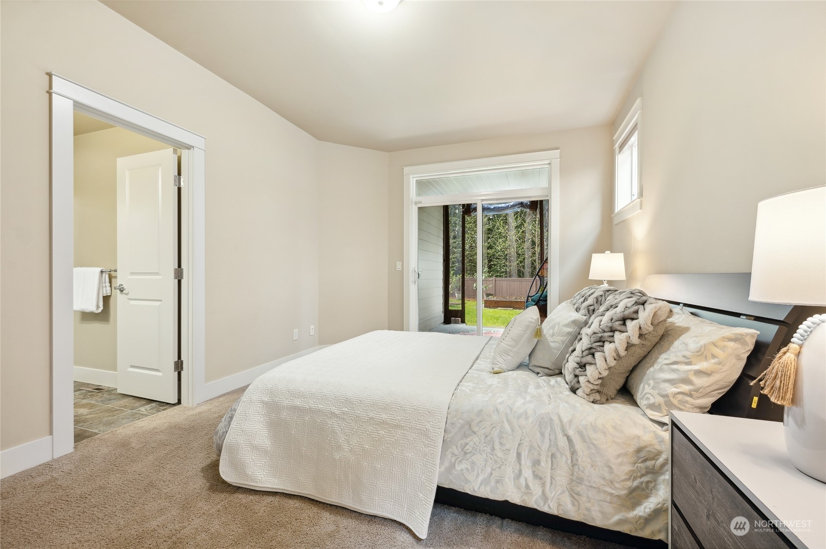 10719 Elliston Way Northeast Redmond, WA 98053 - Photo 12 of 39 a bedroom with a bed and wooden floor
