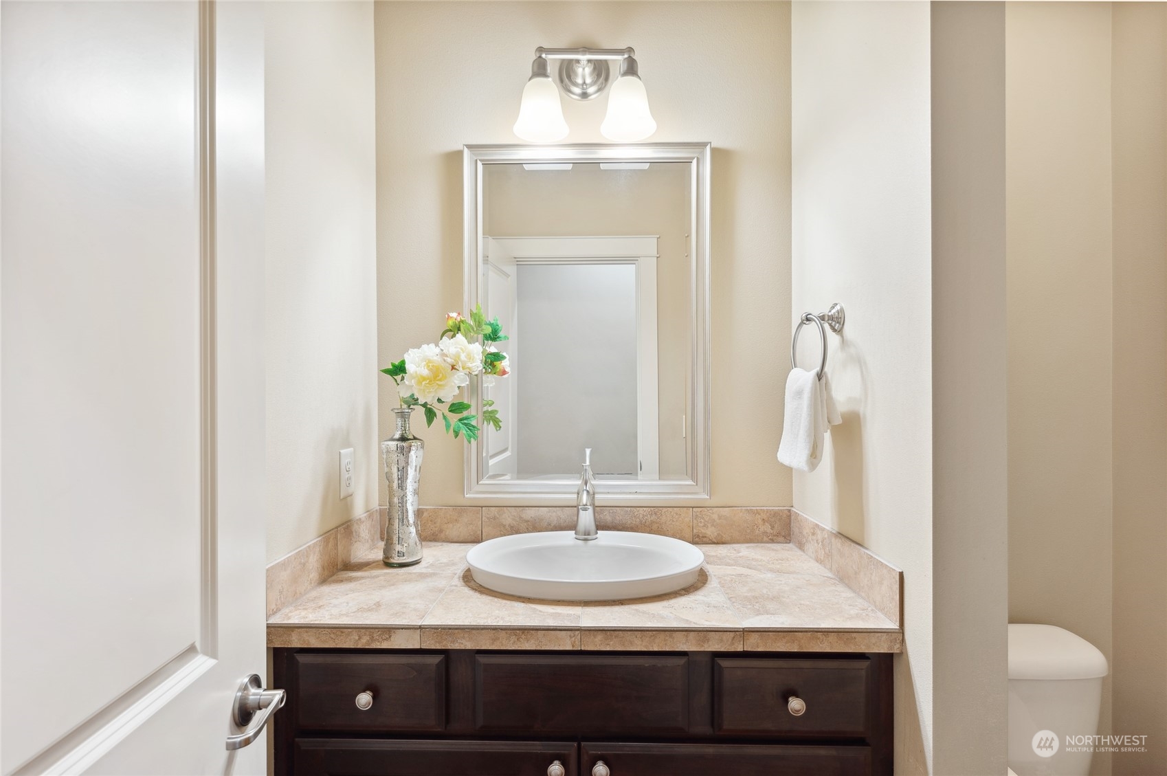 10719 Elliston Way Northeast Redmond, WA 98053 - Photo 15 of 39 a bathroom with a granite countertop sink and a mirror