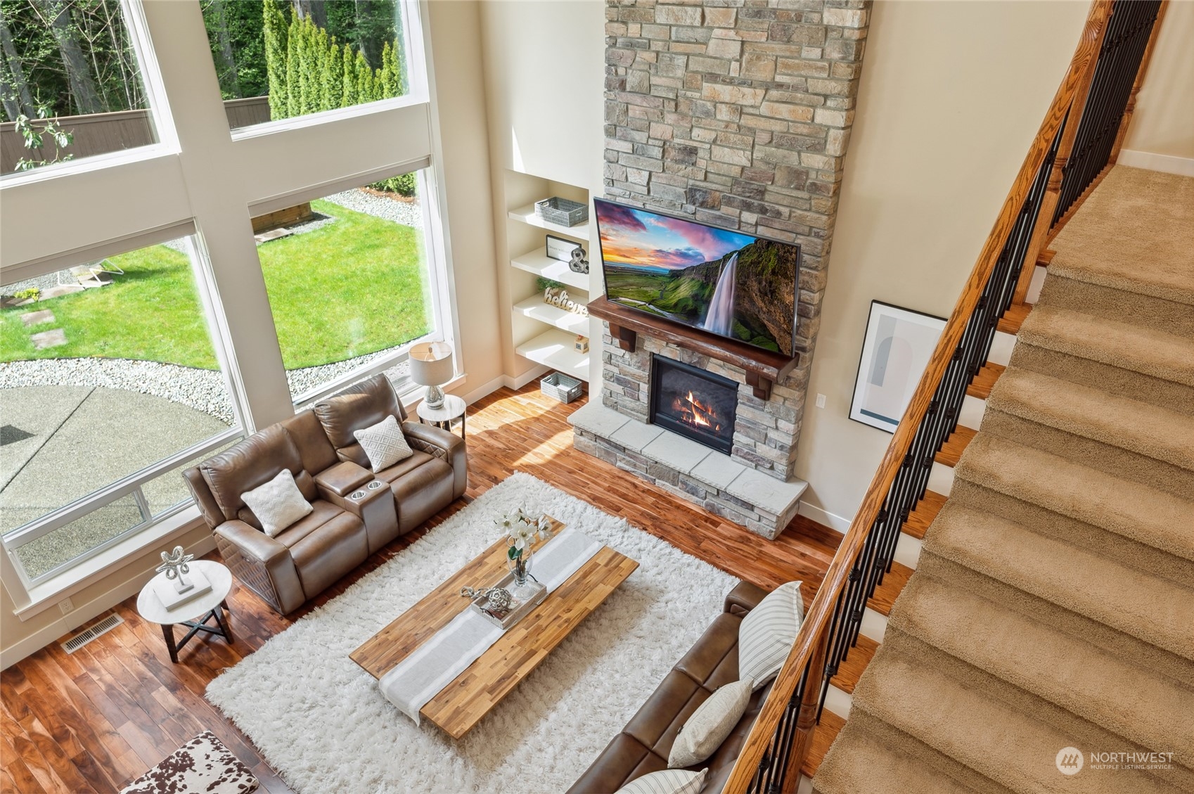 10719 Elliston Way Northeast Redmond, WA 98053 - Photo 16 of 39 a living room with furniture tv and a fireplace