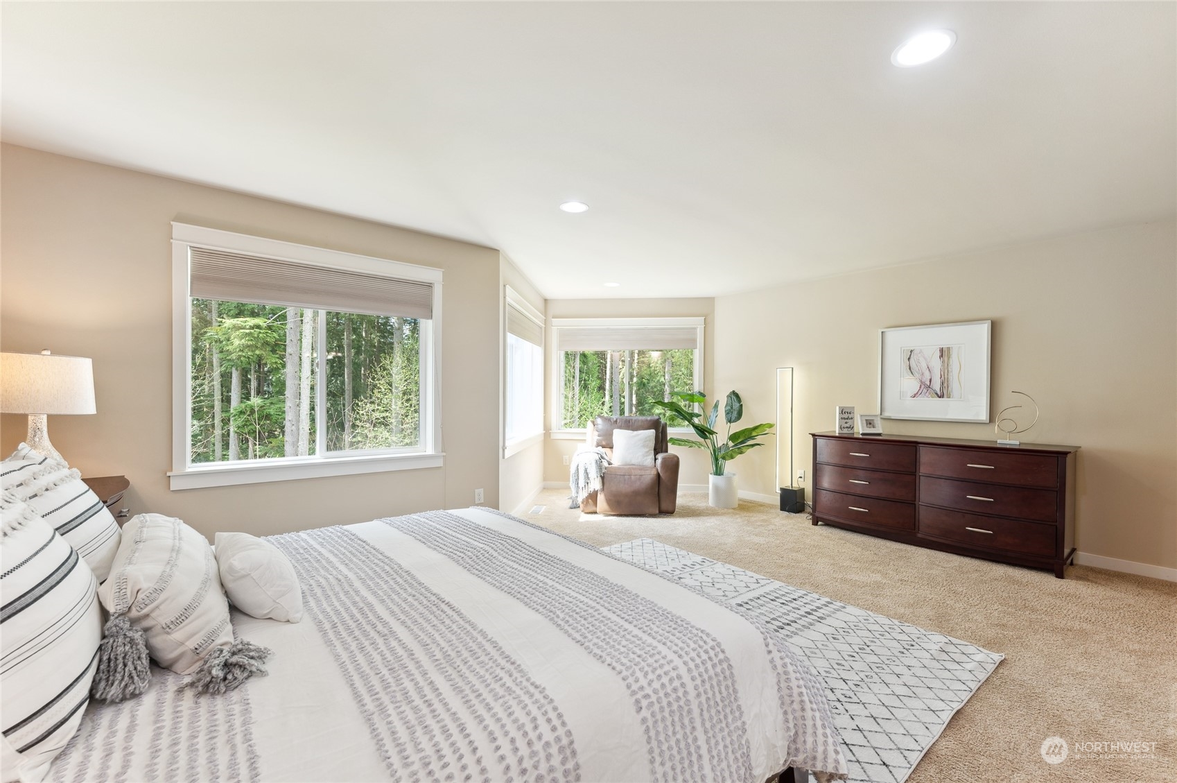 10719 Elliston Way Northeast Redmond, WA 98053 - Photo 18 of 39 a bedroom with a large bed and a dresser