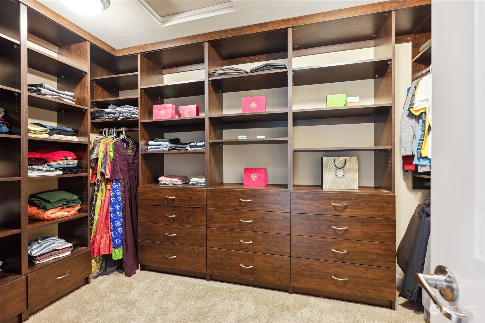 10719 Elliston Way Northeast Redmond, WA 98053 - Photo 20 of 39 a view of walk in closet with clothes and shoes