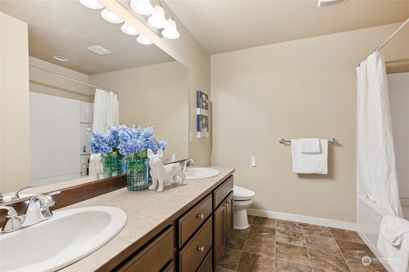10719 Elliston Way Northeast Redmond, WA 98053 - Photo 24 of 39 a bathroom with a granite countertop sink a toilet and a mirror
