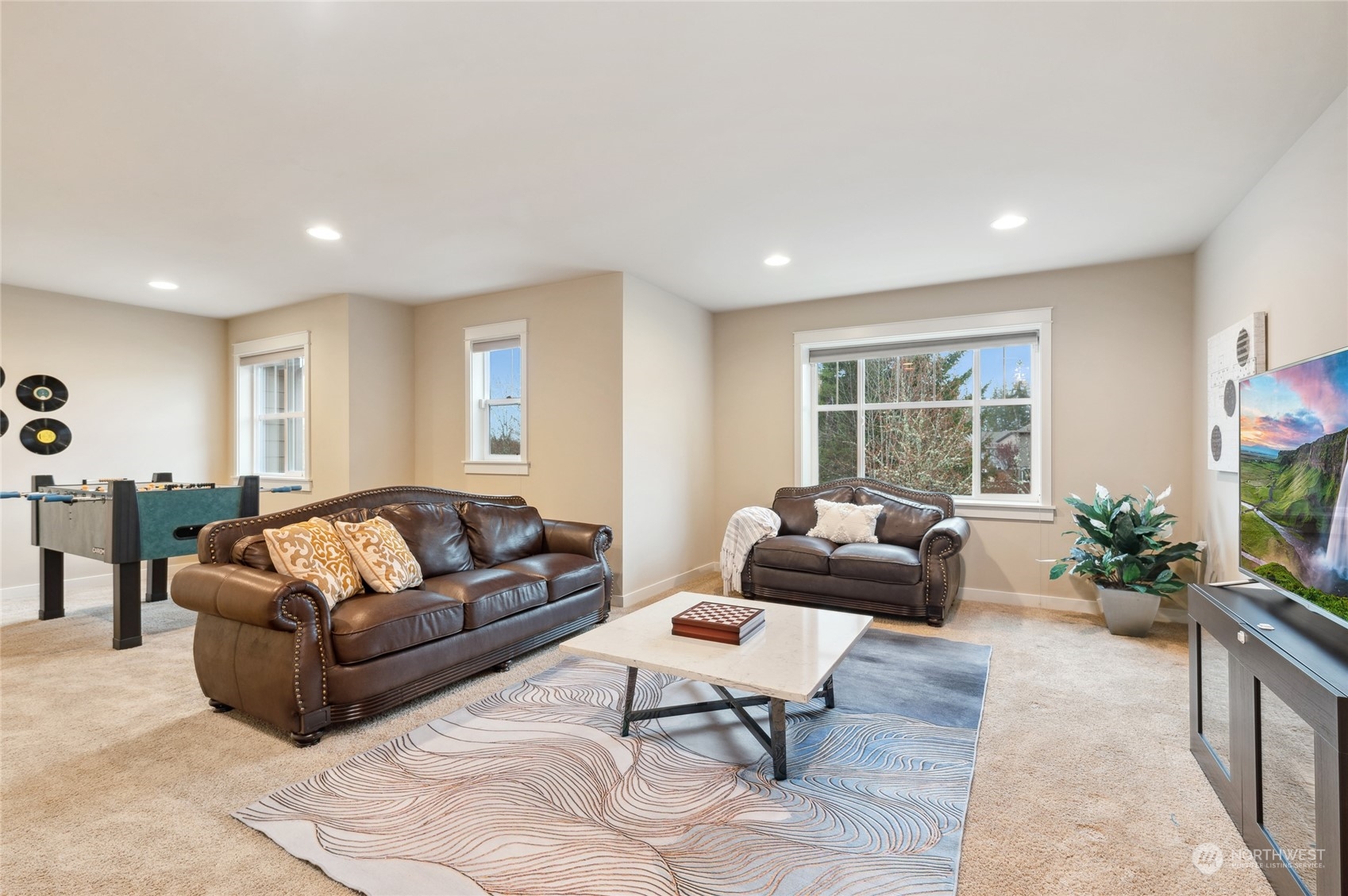 10719 Elliston Way Northeast Redmond, WA 98053 - Photo 26 of 39 a living room with furniture and a potted plant