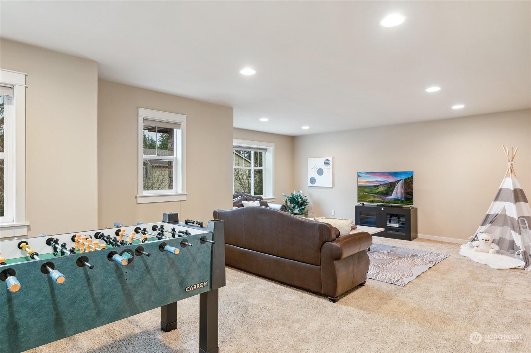 10719 Elliston Way Northeast Redmond, WA 98053 - Photo 27 of 39 a living room with furniture window and a flat screen tv